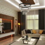 Luxury living room featuring a leaf-patterned wallpaper, a large white L-shaped sectional sofa, and a grand crystal tiered chandelier.