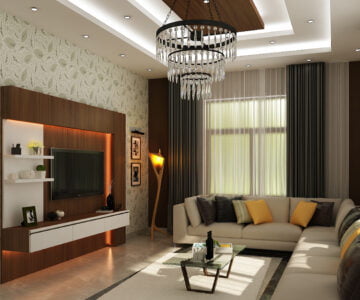 Luxury living room featuring a leaf-patterned wallpaper, a large white L-shaped sectional sofa, and a grand crystal tiered chandelier.