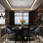 Contemporary living room interior in Kerala featuring a custom floor-to-ceiling geometric wooden partition, neutral-toned luxury sofa, and designer window drapes.