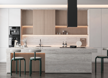 Luxury U-shaped kitchen in Kochi with customized wood-finish upper cabinets, grey base units, and a large window for natural lighting.